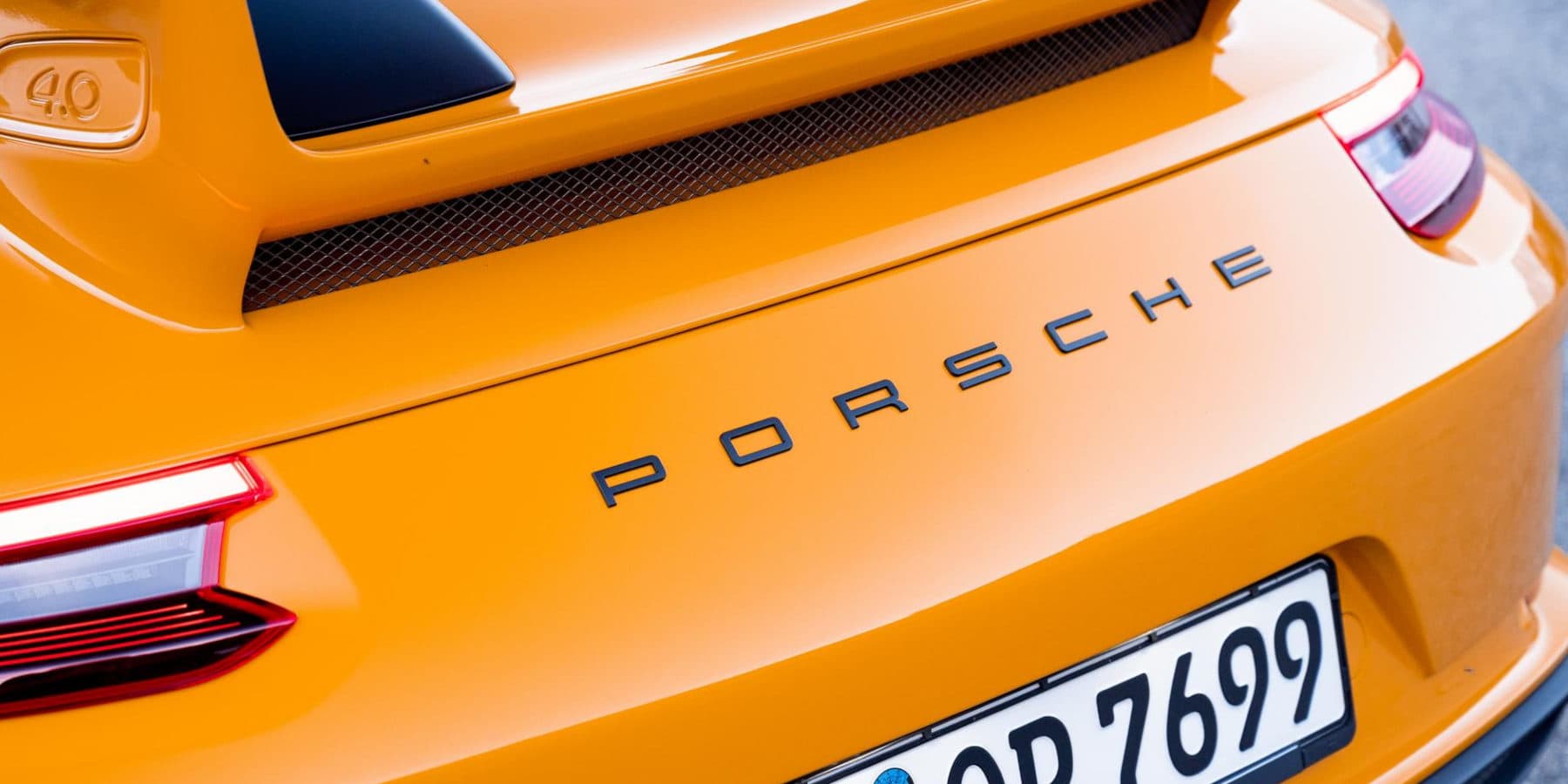 Porsche Schriftzug Logo orange